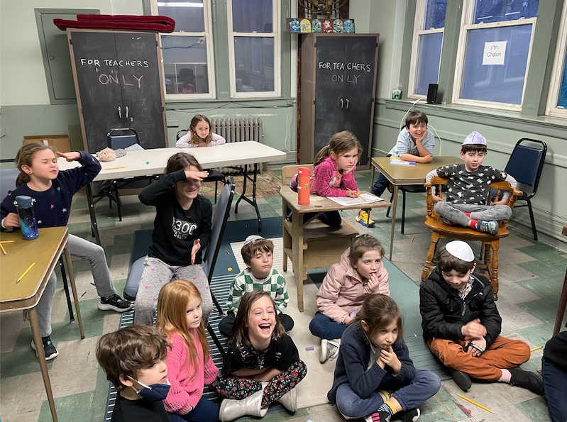 Students in Hebrew school respond to an entertaining lesson